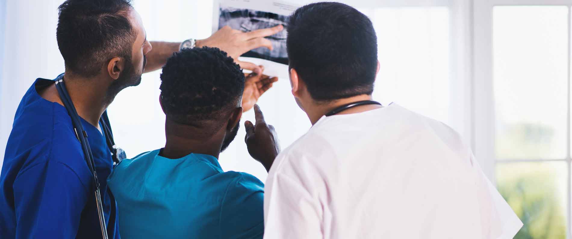 Radiology professionals reviewing scan