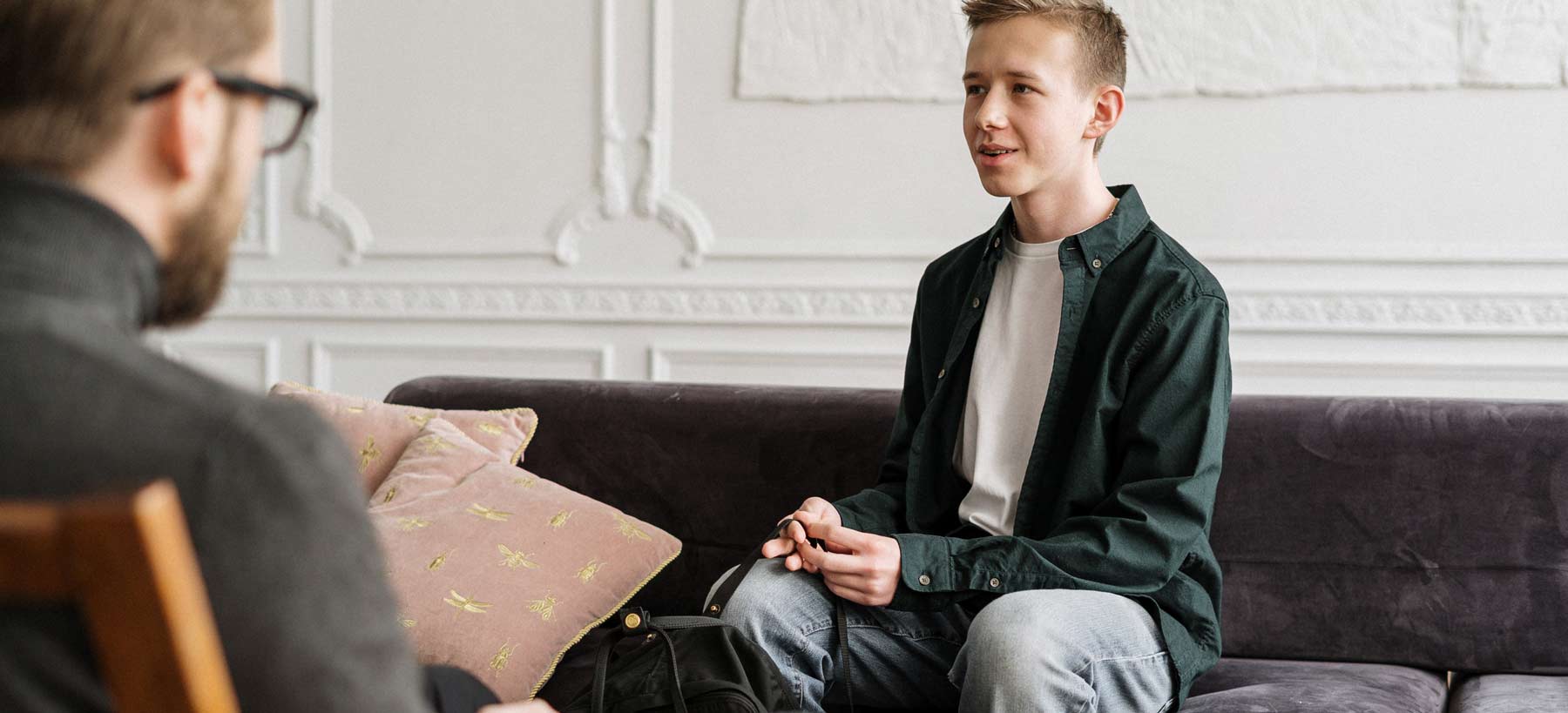 male behavior therapist working with adolescent patient