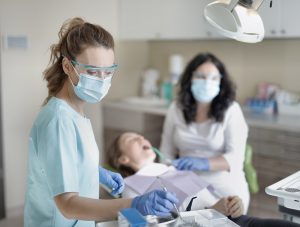 Dental Hygienist with Patient